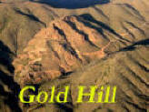 Gold hill with name on photo