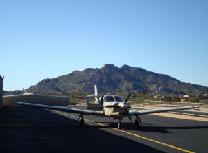 Airplane with mountain behind